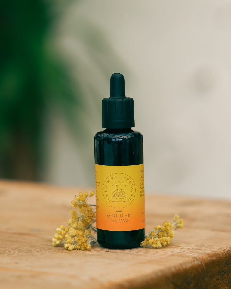 an image of the front of a bottle of golden glow face oil