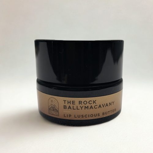 Black container of lip butter