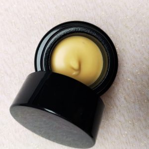 top-down image of an open container of lip luscious butter